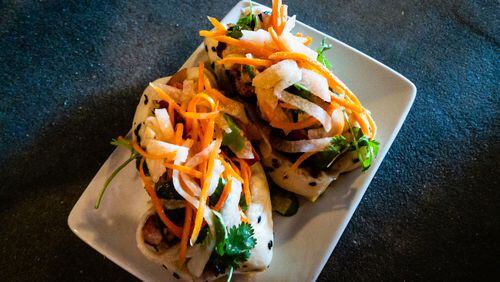 The banh mi pork belly steam buns at the Porter Beer Bar are a delicately constructed, powerfully flavored surprise.