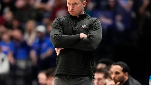 Georgia head coach Mike White watches from the sideline during the first half of an NCAA college basketball game against Florida at the Southeastern Conference tournament Thursday, March 14, 2024, in Nashville, Tenn. The Gators won 85-80.  (AP Photo/John Bazemore)