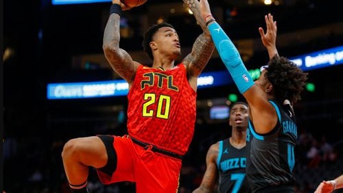 John Collins goes up for a shot during Sunday's game. (AP photo)