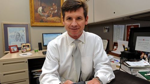 Supreme Lending CEO Pat Flood, shown in his office cubicle, advocates a core belief that an appreciation for customers goes hand-in-hand with job contentment, on Thursday, Feb. 6, 2014, in Alpharetta, Ga. Supreme Lending is Atlanta’s top business in the small division with 150 or fewer employees.