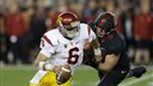 Southern California's Cody Kessler (6) is pressured by Stanford during the second half of a Pac-12 Conference championship NCAA college football game Saturday, Dec. 5, 2015, in Santa Clara, Calif. (AP Photo/Ben Margot)