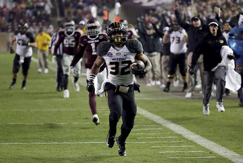 Missouri running back Russell Hansbrough (32) rushes 45 yards for a touchdown against Texas A&amp;M during the second half of an NCAA college football game Saturday, Nov. 15, 2014, in College Station, Texas. (AP Photo/David J. Phillip) This is a picture of Missouri. Georgia wants Missouri to lose. (David J. Philip/AP photo)