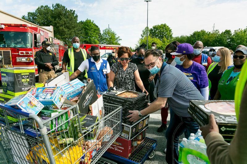 Stephanie Morales, of Pine Lake, exits Sam’s Club recently after the retailer donated more than $1,000 in food and supplies to her “Feeding the Front Lines” project, which provides free meals to first responders during the COVID-19 pandemic.(Photos: Cindy M. Brown)