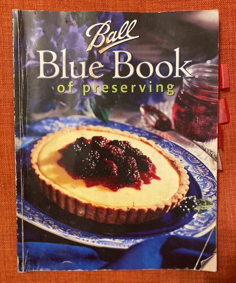 The home canning guide known today as the "Ball Blue Book of Preserving" first was published in 1909. Pictured is a 2003 edition. Ligaya Figueras/ligaya.figueras@ajc.com