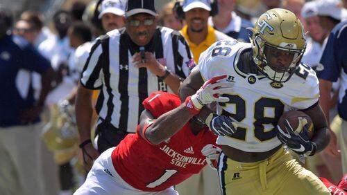 Georgia Tech running back J.J. Green (28) runs down the sidelines until he is pushed out by Jacksonville State safety Marlon Bridges (1) in the first half of Jackets’ home opener at Bobby Dodd Stadium Saturday, Sept. 9, 2017, in Atlanta.