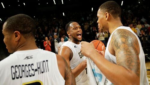 Georgia Tech's Nick Jacobs, right, celebrates with teammate Charles Mitchell after Tech beat Pittsburgh 63-59 in an NCAA college basketball game Saturday, March 5, 2016, in Atlanta. (AP Photo/David Goldman)
