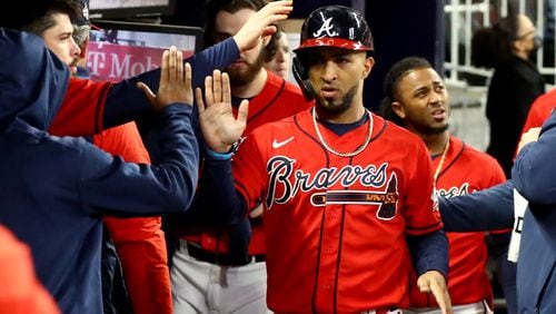 Braves left fielder Eddie Rosario reacts after scoring a run in game 3 of the World Series at Truist Park, Friday October 29, 2021, in Atlanta. Curtis Compton / curtis.compton@ajc.com