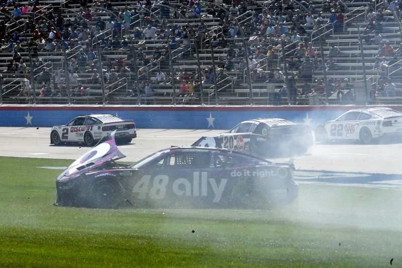 Alex Bowman (48) spins out on the infield after crashing coming out of Turn 4 during a NASCAR Cup Series auto race at Texas Motor Speedway in Fort Worth, Texas, Sunday, April 14, 2024. (AP Photo/Randy Holt)
