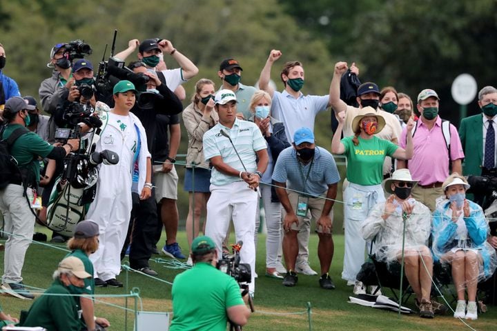 April 10, 2021, Augusta: The gallery reacts after Hideki Matsuyama chips toward the eighteenth green during the third round of the Masters at Augusta National Golf Club on Saturday, April 10, 2021, in Augusta. Curtis Compton/ccompton@ajc.com