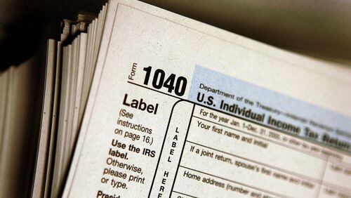 DES PLAINES, IL - MARCH 23: The top of a form 1040 individual income tax return for 2005 is seen atop a stack on the same at the Des Plaines Public Library March 23, 2006 in Des Plaines, Illinois. Americans are preparing for the income tax filing deadline next month whether using tax software, filing on the paper forms or using a tax preparer.  (Photo by Tim Boyle/Getty Images)