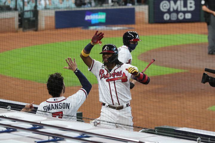 Braves' Ronald Acuna reacts to hitting a solo home run for a 1-0 lead in the first inning of Game 1 of the National League Division Series against the Miami Marlins Tuesday, Oct. 6, 2020, at Minute Maid Park in Houston. (Curtis Compton / Curtis.Compton@ajc.com)