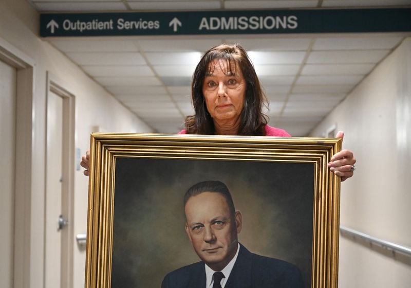 Patricia Goodman holds a portrait of her grandfather, Dr. Job Caldwell Patterson, who founded the Southwest Georgia Regional Medical Center, formerly known as Patterson Hospital. (Hyosub Shin / Hyosub.Shin@ajc.com)