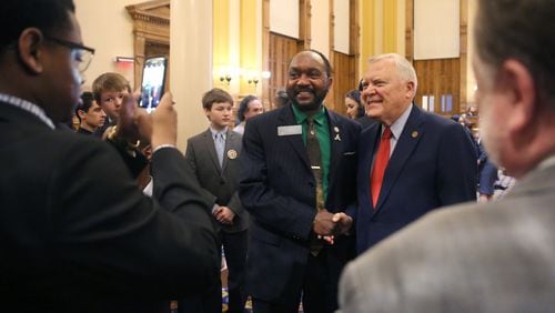 March 29, 2018 - Atlanta, Ga: Sen. Michael 'Doc' Rhett, D-Marietta, gets a photograph with Gov. Nathan Deal after Gov. Deal addressed the senate during his last Sine Die during Legislative Day 40 at the Georgia State Capitol Thursday, March 29, 2018, in Atlanta. PHOTO / JASON GETZ