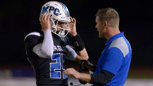 Coach Mitch Jordan and quarterback Niko Vangarelli led Mount Paran Christian to an upset of Aquinas in the first round of the 2019 Class A private-school playoffs. Special/Daniel Varnado