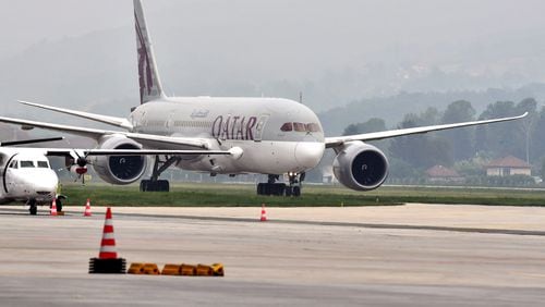 A Qatar Airways Boeing 787 airplane transporting medical protective gear donated by the government of Qatar, lands at Sarajevo International Airport on May 19, 2020, in Sarajevo, Bosnia and Herzegovina. (Elvis Barukcic/AFP/Getty Images/TNS)