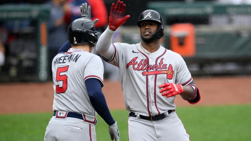 Braves' Jorge Soler (right) celebrates his home run with Freddie Freeman (5) during the fourth inning Sunday, Aug. 22, 2021, against the Orioles in Baltimore. (Nick Wass/AP)