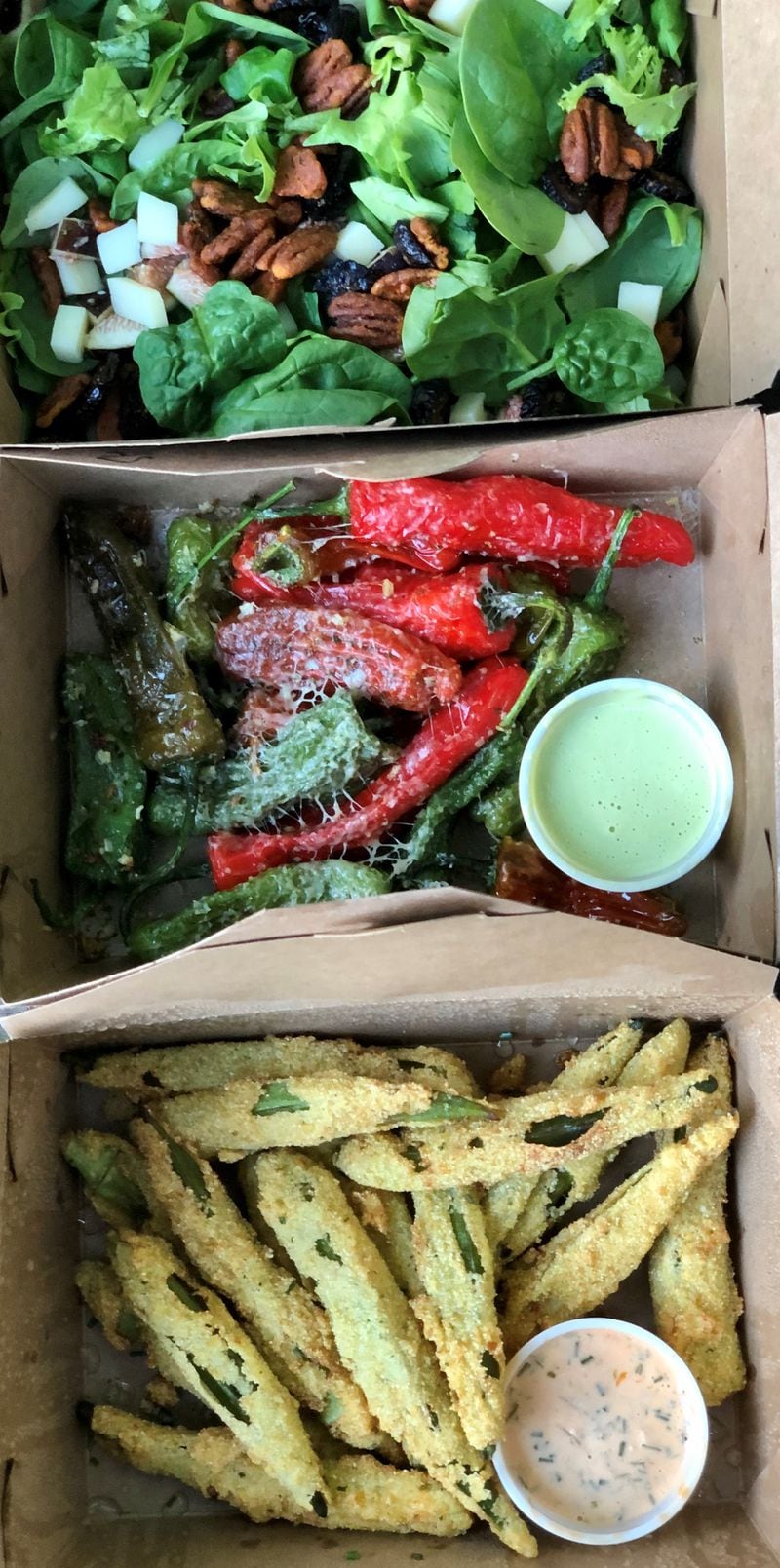 This takeout order from A Mano includes fig salad, blistered shishitos and fried okra. CONTRIBUTED BY WENDELL BROCK
