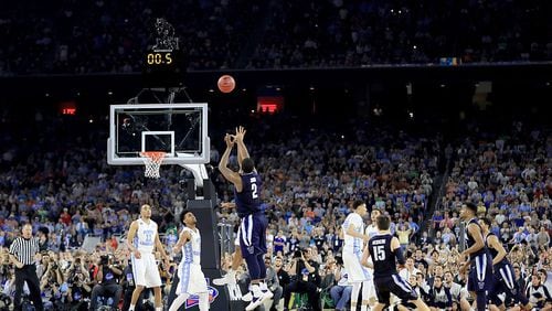 Kris Jenkins of the Villanova Wildcats shoots the game-winning 3-pointer to defeat the North Carolina Tar Heels 77-74 in the 2016 national-championship game at NRG Stadium on April 4, 2016 in Houston, Texas. (Photo by Ronald Martinez/Getty Images)