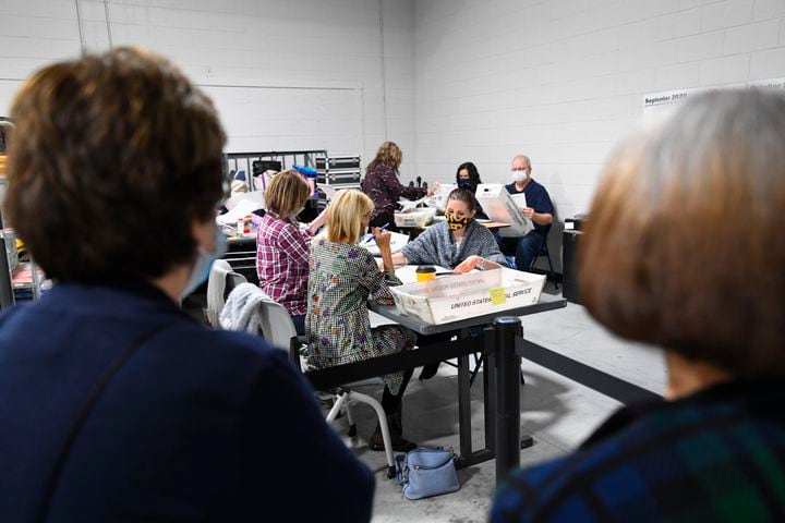Observers watch as during a Presidential vote recount at the Gwinnett County elections office on Friday, Nov.13, 2020 in Lawrenceville. (JOHN AMIS FOR THE ATLANTA JOURNAL-CONSTITUTION)