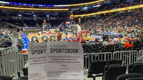Two betting slips from columnist Ken Sugiura's first-ever legal sports wagers, made on the Boston College-Miami game in the ACC tournament March 12, 2024, in Washington D.C. (AJC photo by Ken Sugiura)