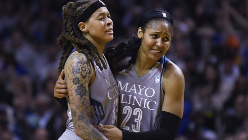FILE - Minnesota Lynx guard Seimone Augustus (33) and forward Maya Moore (23) embrace after Game 5 of the team's WNBA Finals against the Los Angeles Sparks, Oct. 4, 2017 in Minneapolis. The Women’s Basketball Hall of Fame had a huge Minnesota feel to it with the induction of Moore and Augustus getting enshrined on Saturday, April 25, 2024. (Aaron Lavinsky/Star Tribune via AP, File)
