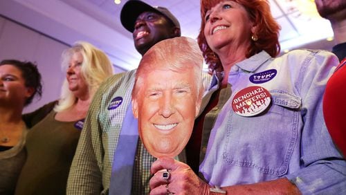 082916 MARIETTA: Trump supporter Lyn Murphy (cq) bears his face in hand during Republican Vice Presidential nominee and Indiana Governor Mike Pence’s campaign stop to shore up support for Donald Trump in Georgia at the Cobb-Marietta Coliseum & Exhibit Hall Authority on Monday, August 29, 2016, in Marietta. Curtis Compton /ccompton@ajc.com
