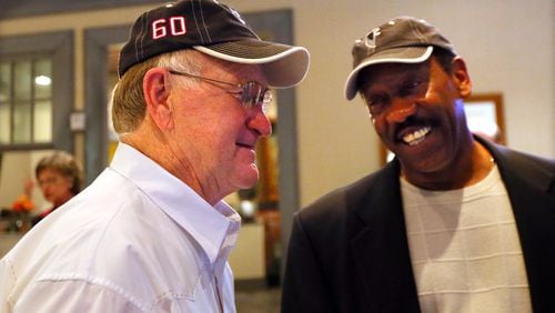 Falcons first-ever draft pick linebacker Tommy Nobis (left) shares a laugh with teammate safety Ray Brown during a reunion on Saturday, May 4, 2013, at Lake Lanier Islands Resort. CURTIS COMPTON / CCOMPTON@AJC.COM