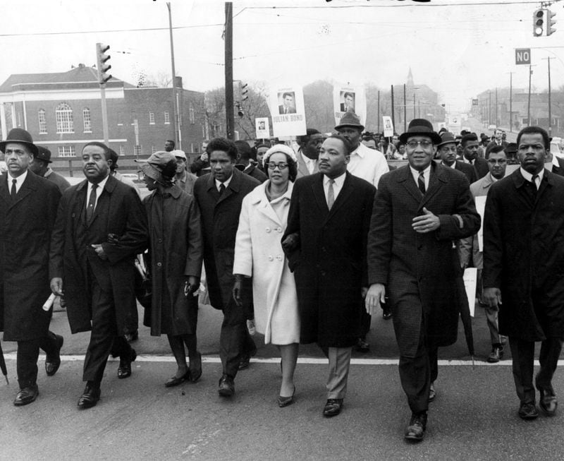 Coretta often accompanied her husband in civil rights marches. In this 1966 march, John Lewis, (far right), Dr. Martin Luther King Jr. (third from right), his wife Coretta Scott King, Ralph David Abernathy (second left), lead protestors from Atlanta University to the Georgia state Capitol. (Hugh Stovall/AJC staff) 1966