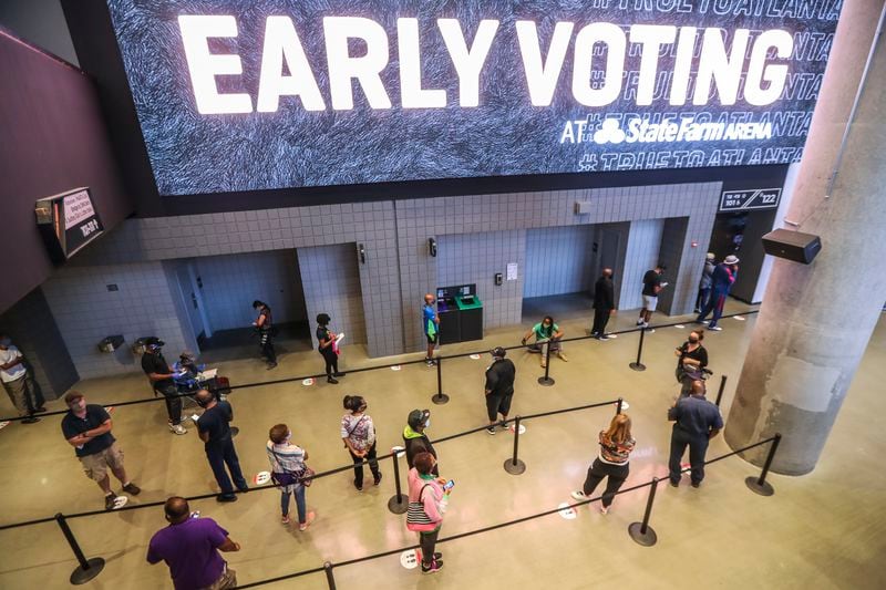 Voters wait to cast ballots at State Farm Arena in Atlanta on Oct. 12, the first day of early voting. Georgia's emergence as a swing state may make it an unusually attractive target for foreign agents or political operatives who want to disrupt the 2020 elections. (John Spink / John.Spink@ajc.com)

