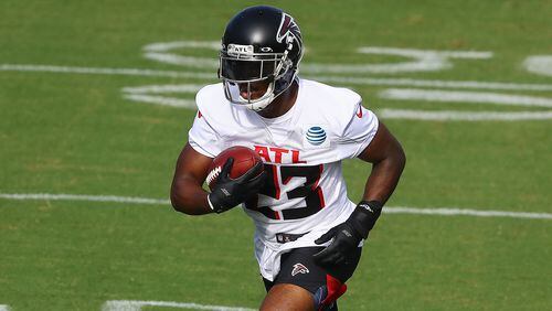 Falcons running back Brian Hill carries the ball during training camp on Thursday, August 27, 2020 in Flowery Branch.    Curtis Compton ccompton@ajc.com