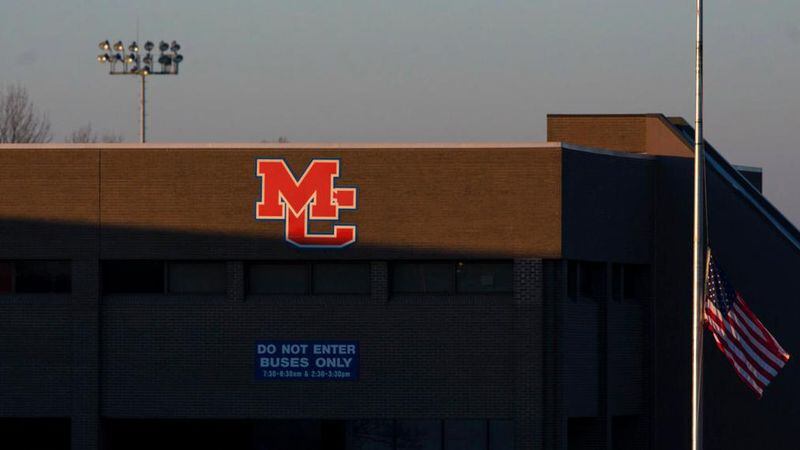 A flag outside Marshall County High School in Benton, Ky., flies at half-staff Thursday, Jan. 25, 2018. On Tuesday, a 15-year-old student opened fire at the school, killing two teenagers and wounding several others. (Ryan Hermens/The Paducah Sun via AP)