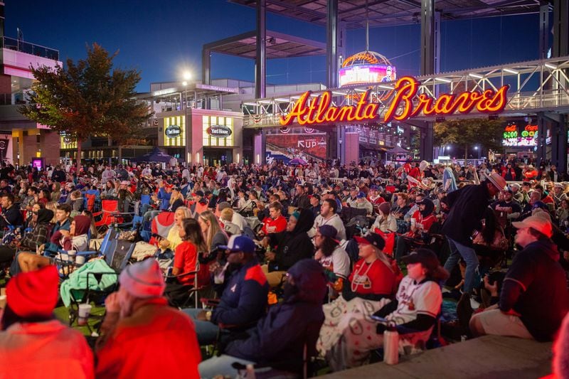 Braves fans gather at The Battery at Truist Park to watch Game 1 of the World Series from Houston on Tuesday, Oct. 26, 2021, in Atlanta. The series shifts from Houston to Atlanta on Friday. (Branden Camp/For the AJC)