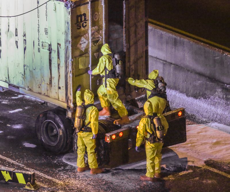 A federal agency said Tuesday it will help state and local agencies investigate a chemical spill caused by a tractor-trailer wreck before dawn Monday on the Downtown Connector that snarled traffic for hours. JOHN SPINK /JSPINK@AJC.COM