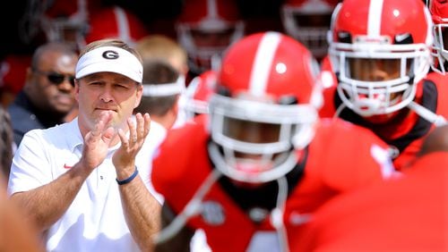 Kirby Smart and Georgia players take the field for the annual G-Day spring intrasquad football game on Saturday, April 21, 2018, in Athens.  Curtis Compton/ccompton@ajc.com