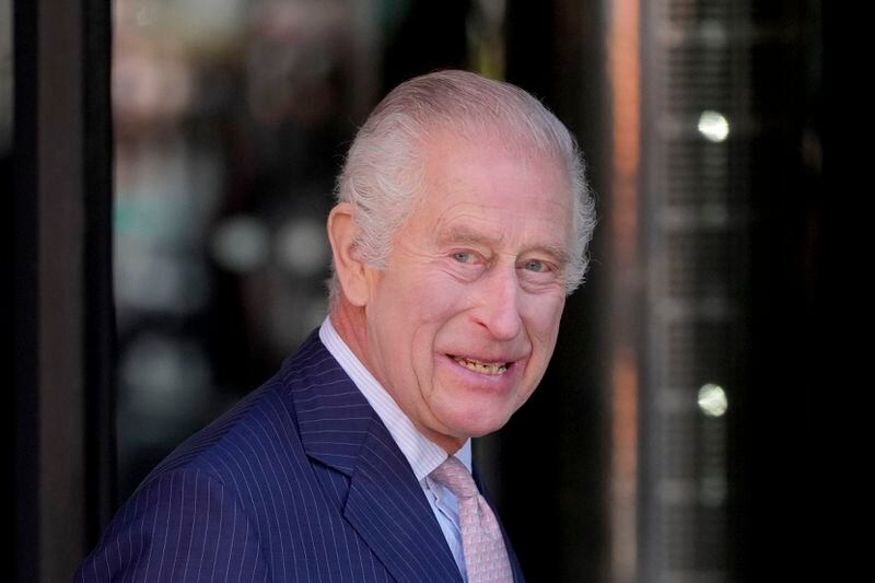 Britain's King Charles III smiles as he arrives for a visit to University College Hospital Macmillan Cancer Centre in London, Tuesday, April 30, 2024. The King, Patron of Cancer Research UK and Macmillan Cancer Support, and Queen Camilla visited the University College Hospital Macmillan Cancer Centre, meeting patients and staff. This visit is to raise awareness of the importance of early diagnosis and will highlight some of the innovative research, supported by Cancer Research UK, which is taking place at the hospital. (AP Photo/Kin Cheung)