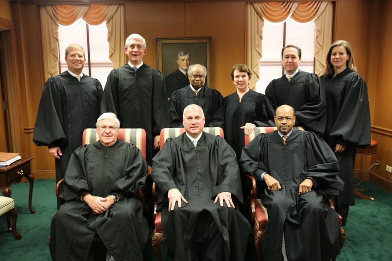 Superior Court Judge Eric Norris (front row, center), when he sat as a visiting state Supreme Court justice because another justice had a conflict of interest. First row (from left to right): late Justice Harris Hines, Norris and former Justice Harold Melton. Back row (left to right): Justices Nels Peterson and David Nahmias and former Justices Robert Benham, Carol Hunstein, Keith Blackwell and Britt Grant. (Photo: Judgenorris.com)