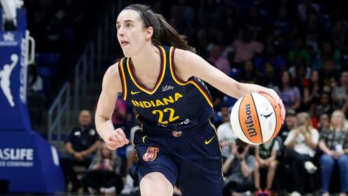 Indiana Fever guard Caitlyn Clark looks to shoot against the Dallas Wings during the first half of an WNBA basketball game in Arlington, Texas, Friday, May 3, 2024. (AP Photo/Michael Ainsworth)