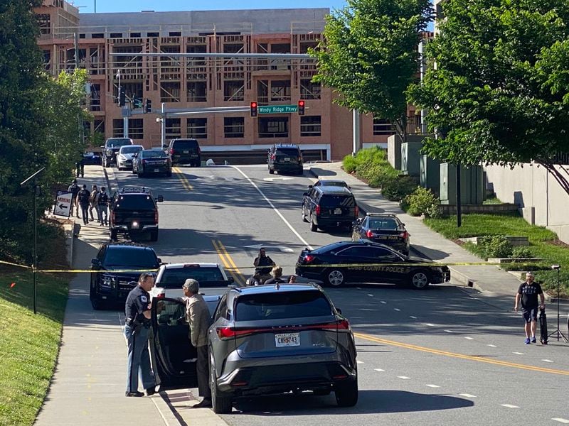 There is heavy police presence near The Battery Atlanta as Cobb police, along with Atlanta police and other local agencies, continue their search for the man suspected in a shooting in Midtown.