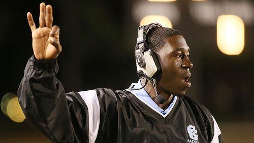 Cedar Grove's head coach Jermaine Smith signals his players. (Phil Skinner/Special to AJC)