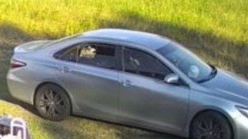 Douglasville police released a photo of a silver Toyota Camry in which they believe two people fled the scene of a deadly shooting in a Kroger parking lot.