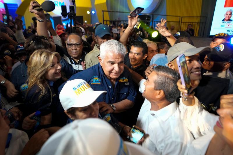 Presidential candidate Jose Raul Mulino, of the Achieving Goals party, is surrounded by supporters after winning on the day of the general electing in Panama City, Sunday, May 5, 2024. (AP Photo/Matias Delacroix)