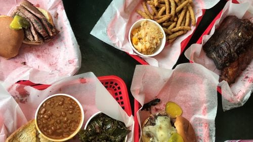 The brisket sandwich and other dishes at Pit Boss BBQ.