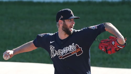 Braves pitcher Chris Martin delivers from the practice mounds during a morning session at spring training Thursday, Feb. 25, 2021, at CoolToday Park in North Port, Fla. (Curtis Compton / Curtis.Compton@ajc.com)