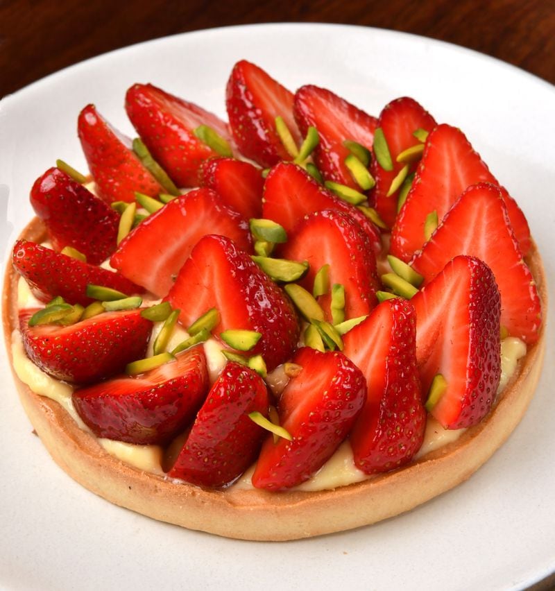 Le Bon Nosh chef Forough Vakili, who went to culinary school in France, loves strawberries, and it shows in her Strawberry Tart. Here, the tart is garnished with toasted chopped pistachios. (Styling by chef Forough Vakili / Chris Hunt for the AJC)