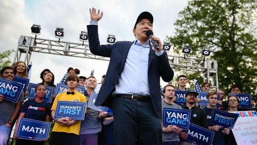 Andrew Yang, who’s seeking the 2020 Democratic presidential nomination, speaks Thursday at a campaign event in Piedmont Park in Atlanta. He offered a warning about automation’s potential impact as a threat to the workplace. He made a pitch for universal basic income as a remedy. The policy calls for giving $1,000 per month to each American over age 18.