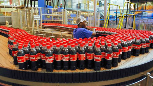 A Birmingham firm has taken over Coca-Cola’s bottling operations in metro Atlanta and other Georgia territories as part of Coke’s efforts to “refranchise” its global bottling operations. File photo of a South African bottling plant. Photographer: Henner Frankenfeld/Bloomberg News.