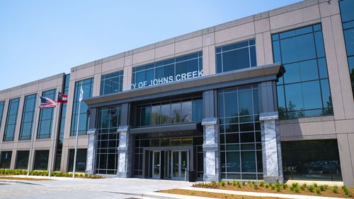The Johns Creek property owner who wants to convert part of his small shopping center into apartments to help keep it open said his rezoning request was unfairly denied and he’s considering legal action against the city.
