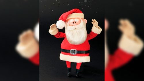 This image released by Profiles in History shows a Santa Claus puppet used in the filming of the 1964 Christmas special "Rudolph the Red-Nosed Reindeer." A buyer shouted out with glee that they would pay $368,000 for the Rudolph and Santa Claus figures used in the special. (Profiles in History via AP)