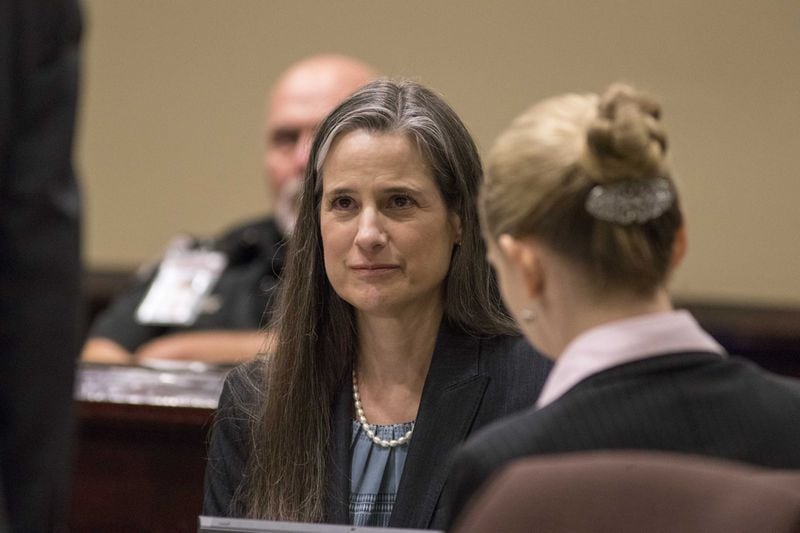 Nydia Tisdale sits with her lawyers on Thursday, Nov. 30, 2017, during her trial at the Dawson Superior Court. 
