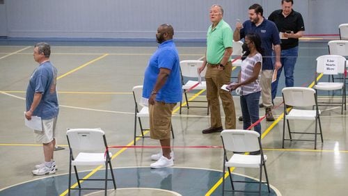 Voters wait in line to vote during an early morning rush at GraceLife Church in Marietta Tuesday morning, May 24, 2022. (Steve Schaefer / steve.schaefer@ajc.com)